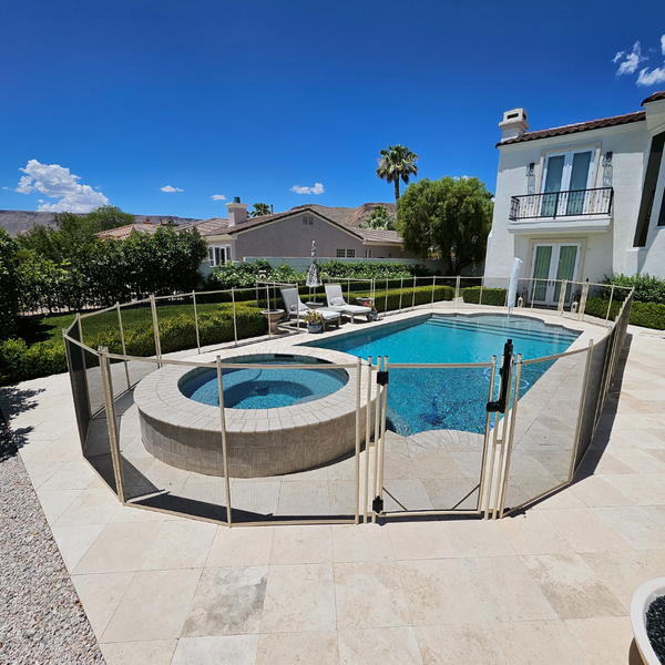 A temporary fence around a pool and hot tub