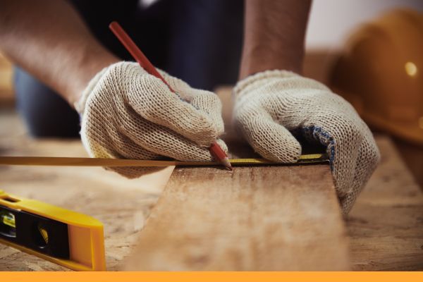 contractor marking line on wood board