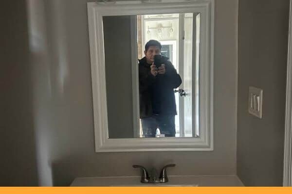 remodel contractor selfie in bathroom mirror