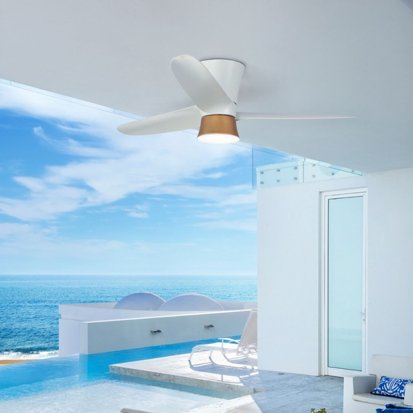 White outdoor ceiling fan on modern patio overlooking ocean