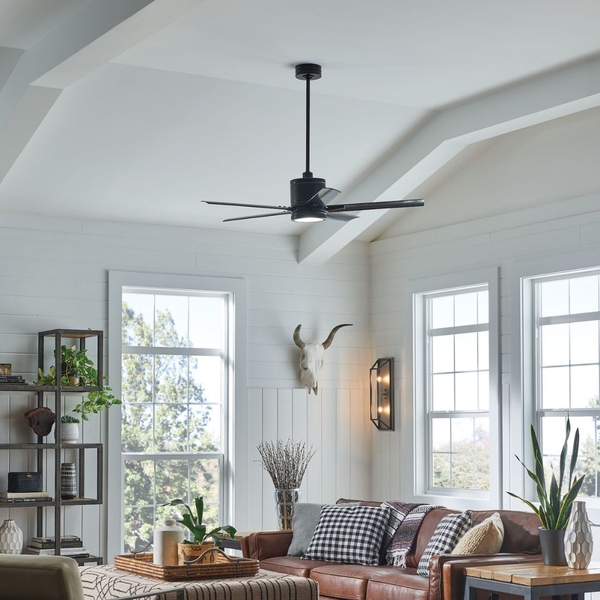 Black modern ceiling fan in bright living room setting