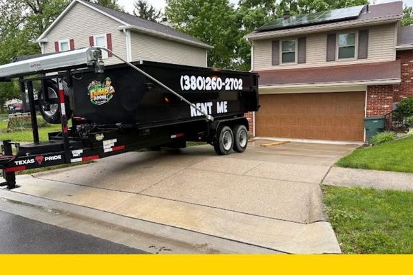 roll off dumpster rental in front of a home