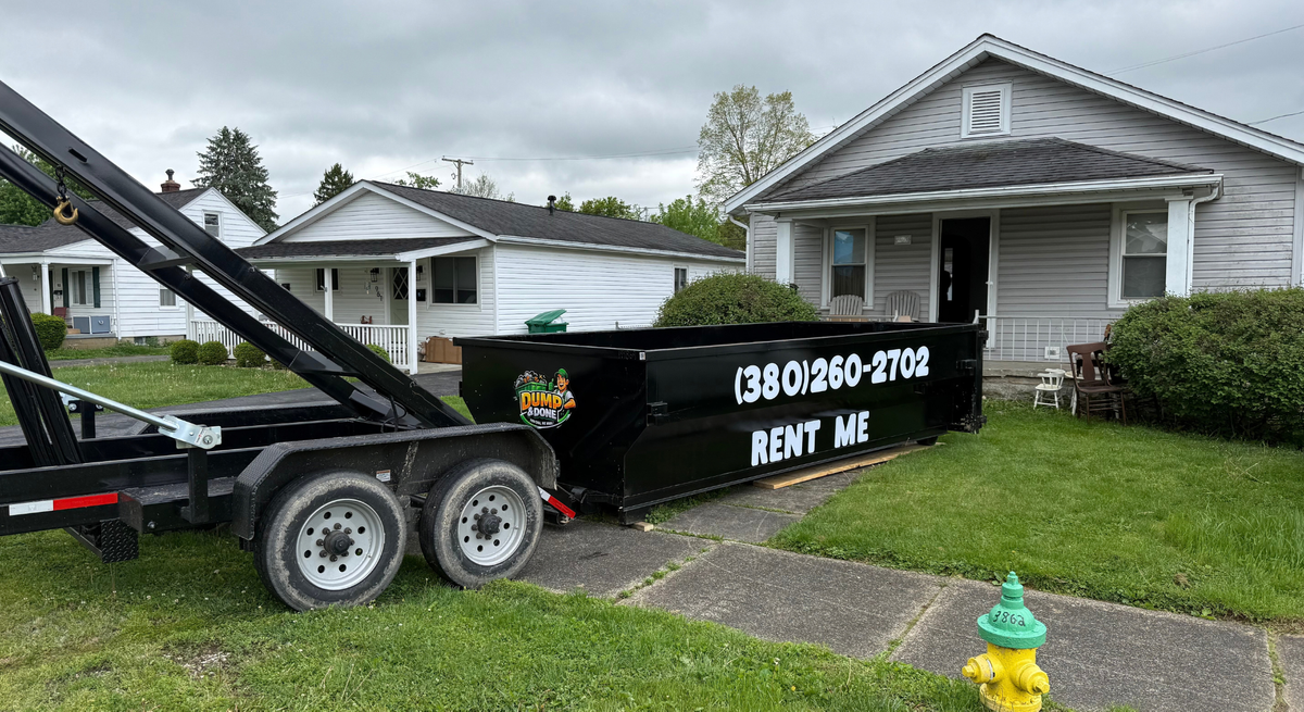 roll off dumpster in front of a home