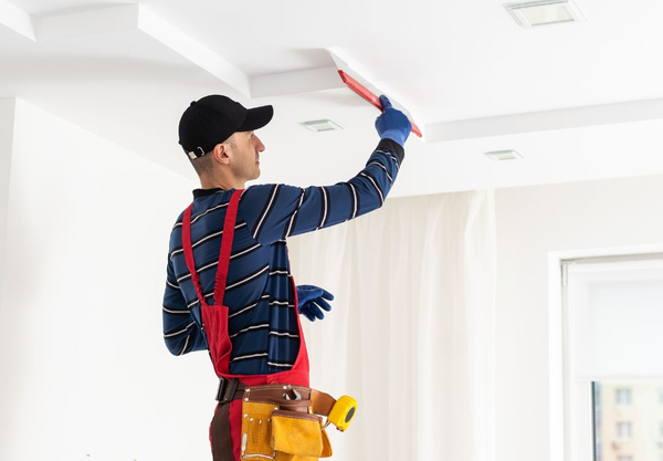 man doing drywall