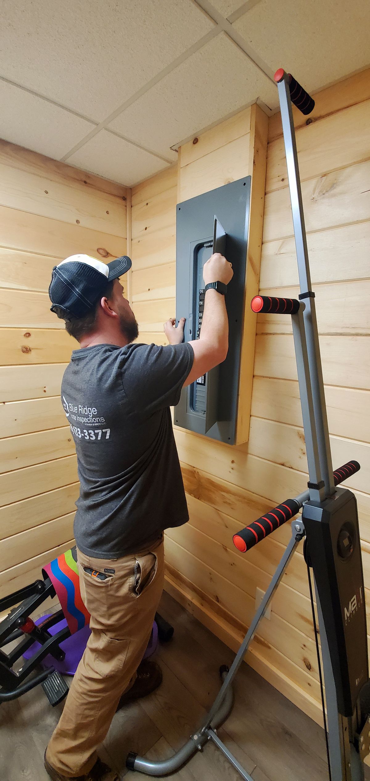 Levi inspecting the electrical panel.jpg