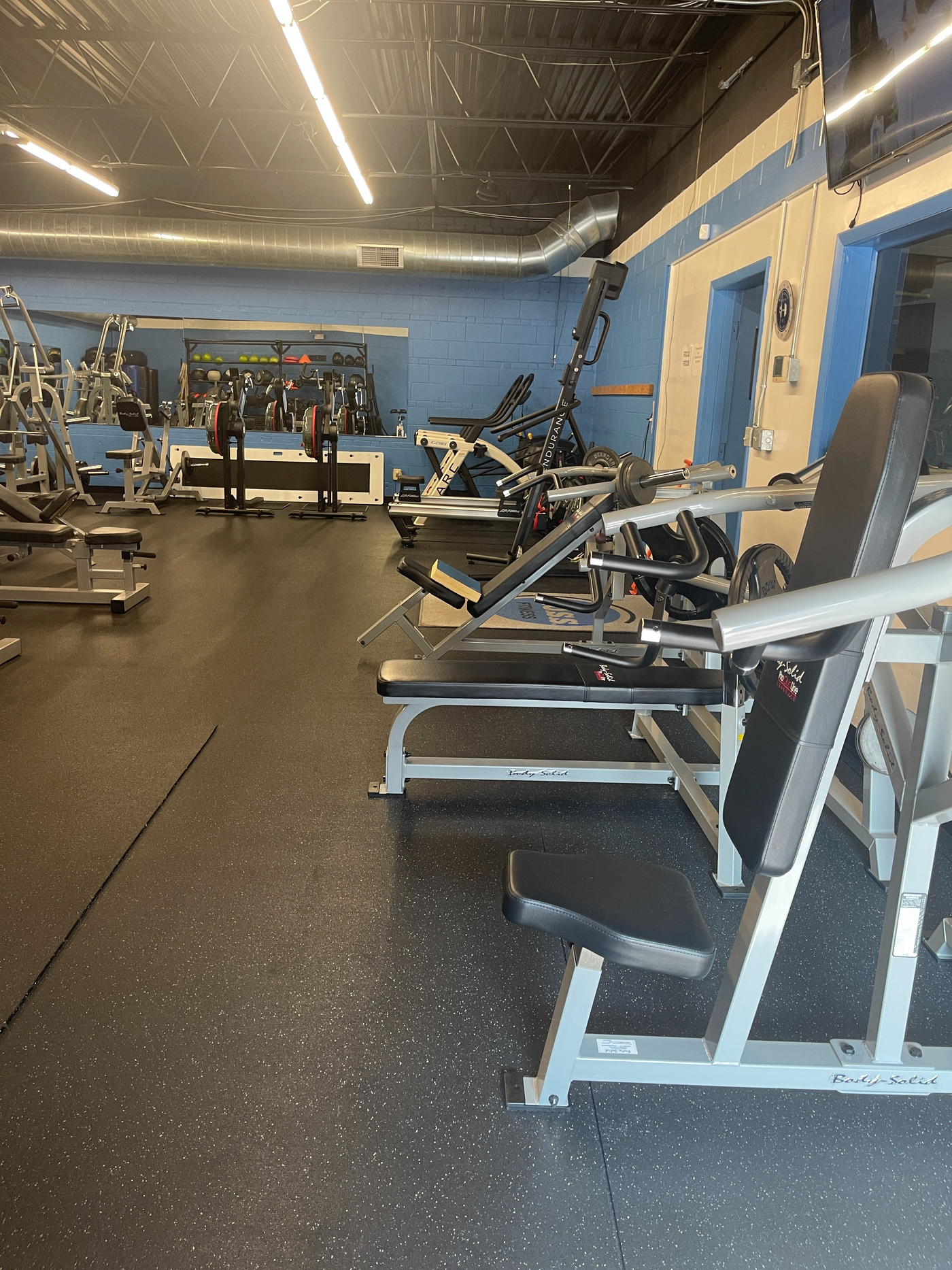Strength equipment and training floor inside B.O.S.S. Fitness