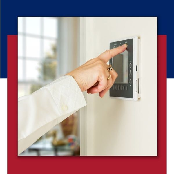 someone changing their thermostat 5050 Images.jpg