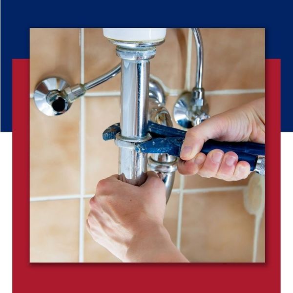 a plumber fixing pipes 5050 Images.jpg