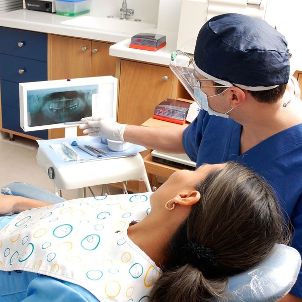 A patient and dentist.