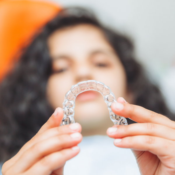 image of a woman with invisalign