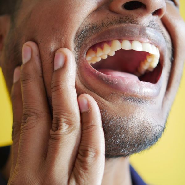 man with mouth open in pain man with mouth open in pain