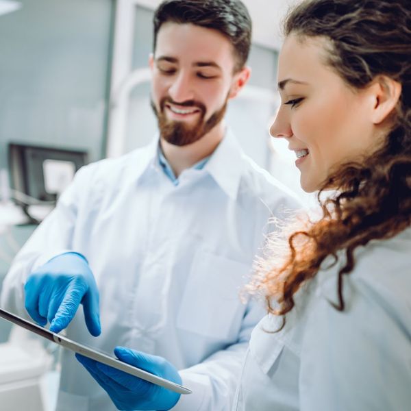 dentist talking with hygienist