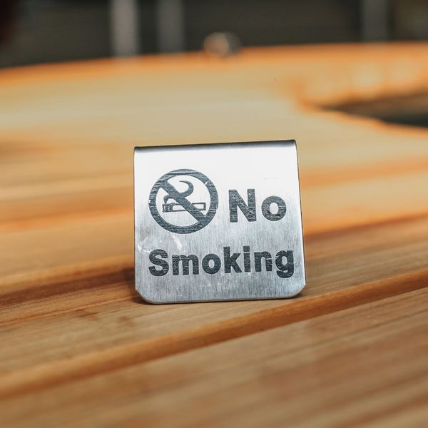 no smoking sign on a table