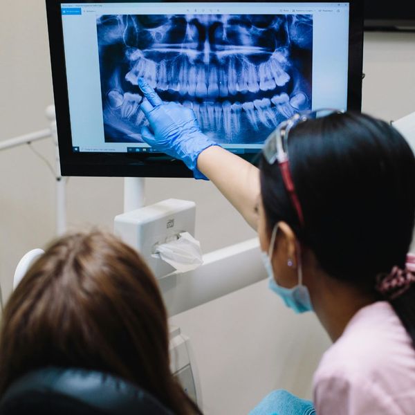 dentist pointing at xray dentist pointing at xray