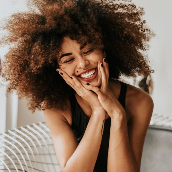 A person with a beautifully bright, confident smile. A person with a beautifully bright, confident smile.