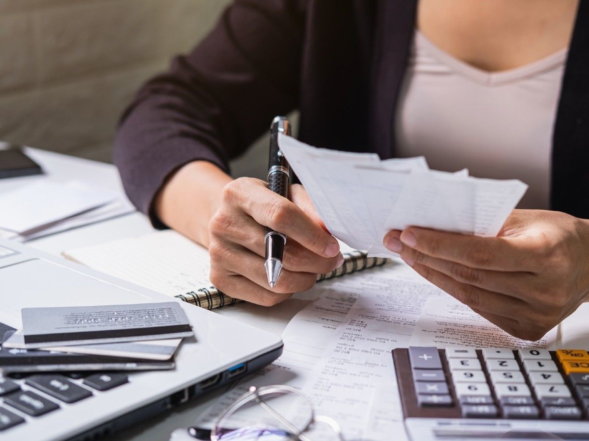 close up image of a woman holding paperwork