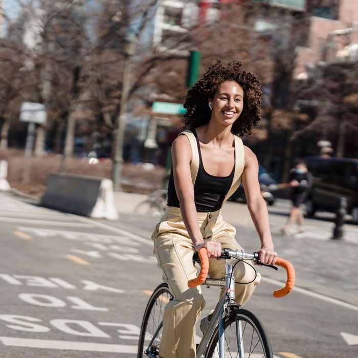 woman riding bike on road