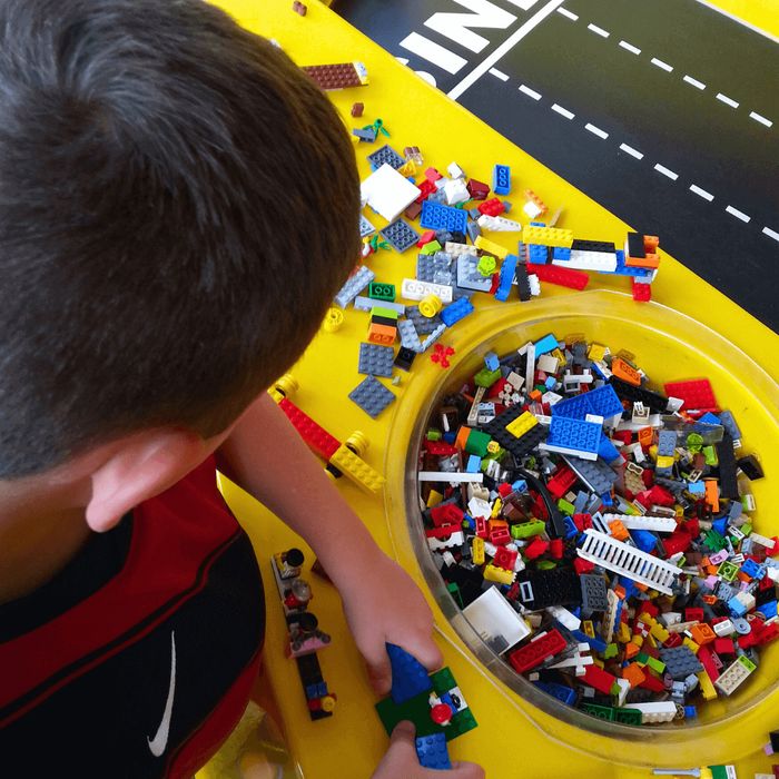 image of a child playing with legos