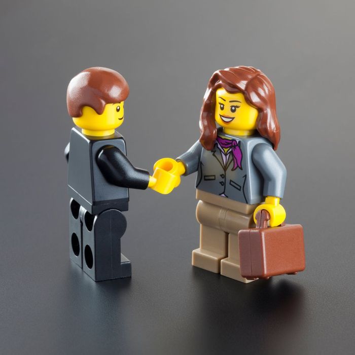 Two business minifigs shaking hands Two business minifigs shaking hands