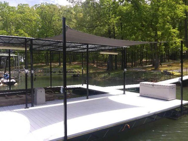 Installed-vinyl-decking-and-shad-cover-with-winch-and-pulley-system.jpg