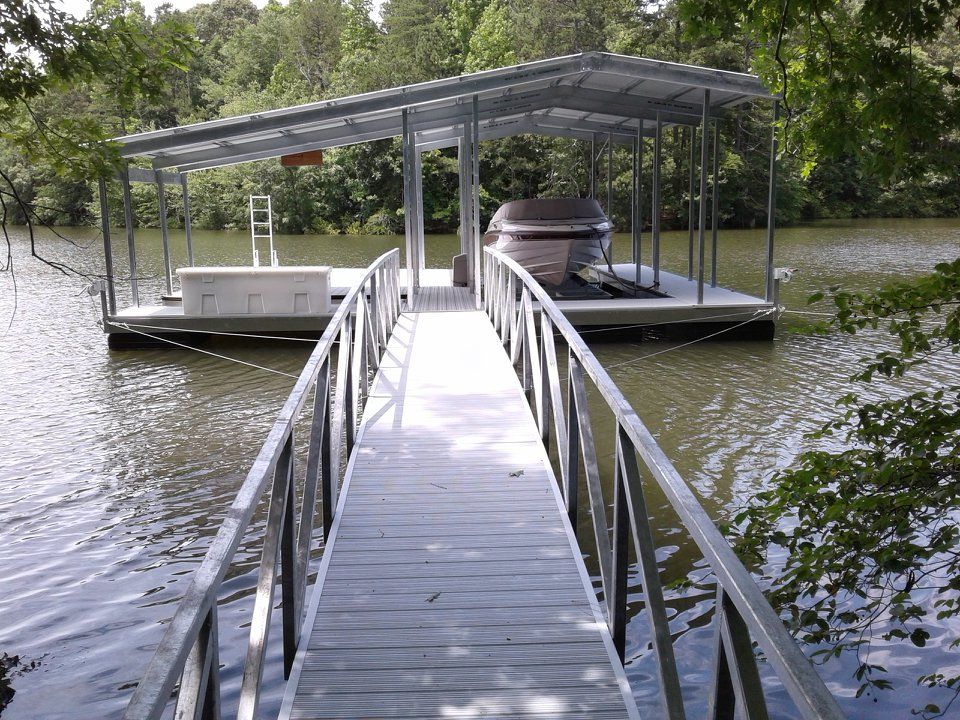 32'x32'; 14'x17' uncovered deck area; 40' arched ramp; vinyl decking; 6500 lb boat lift 32'x32'; 14'x17' uncovered deck area; 40' arched ramp; vinyl decking; 6500 lb boat lift