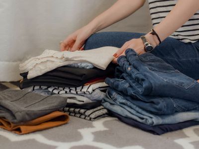 Woman folding clothes.
