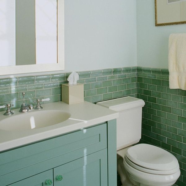 Bathroom with green tiles