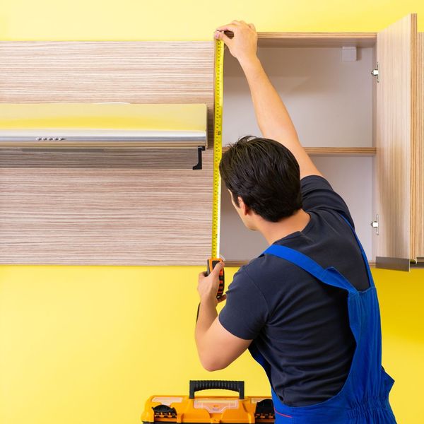 cabinet contractor measuring cabinet height