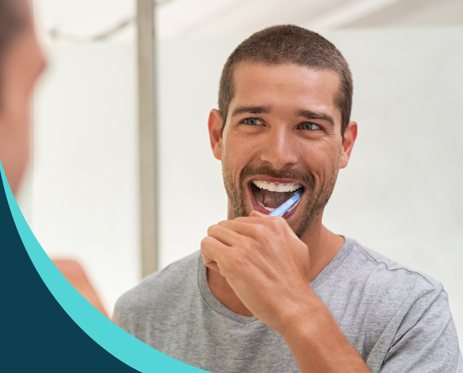 image of a man brushing his teeth