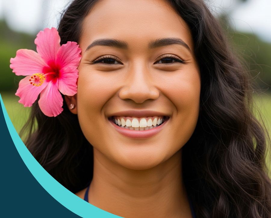 A close-up of a smiling young Hawaiian woman with a pink hibiscus flower in her hair, showcasing her perfect, white teeth. A close-up of a smiling young Hawaiian woman with a pink hibiscus flower in her hair, showcasing her perfect, white teeth.