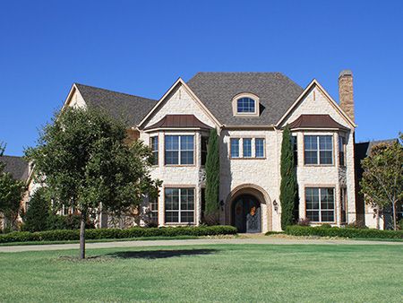 house exterior with green lawn