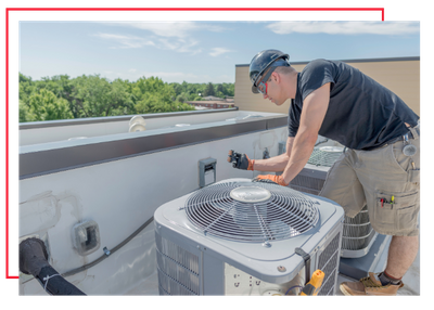 HVAC technician servicing an AC unit. 