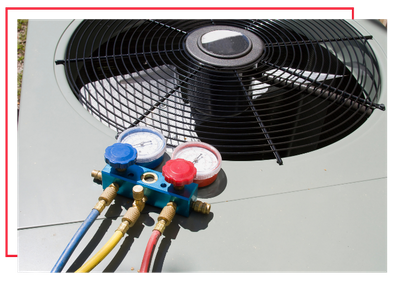 manifold gauge set sitting on an AC unit. 