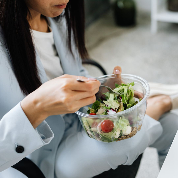 woman eating salad woman eating salad
