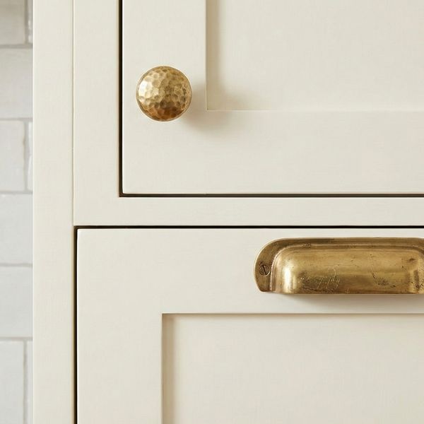 Close-up of cabinets against a tile backsplash