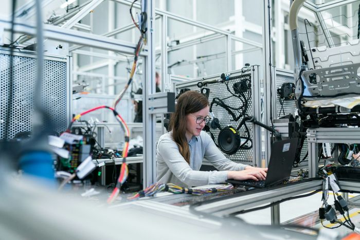 Female engineer hired from fractional recruiting services for manufacturer