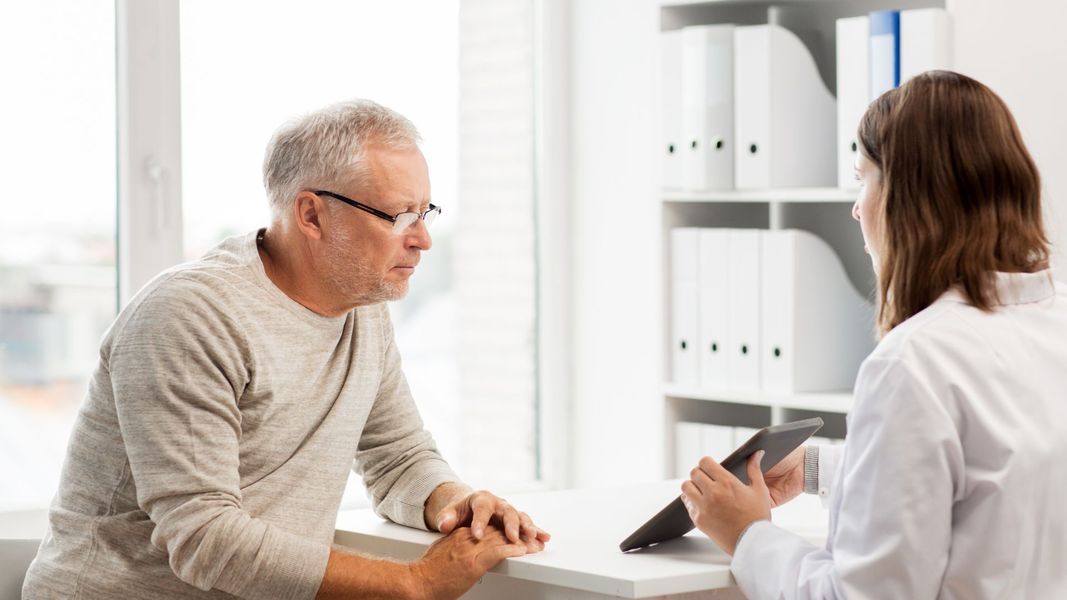 man talking with doctor