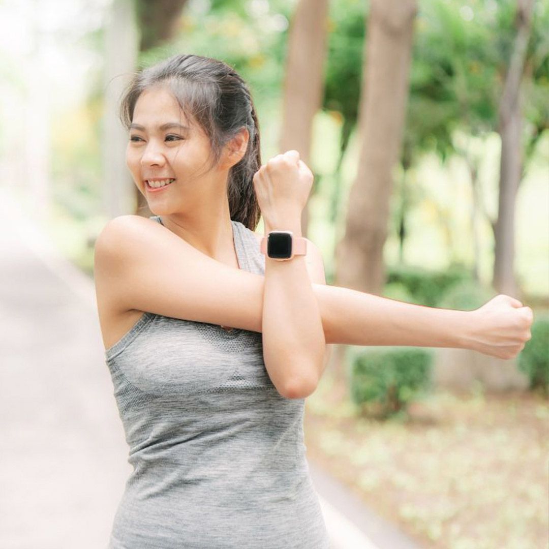 woman stretching shoulder