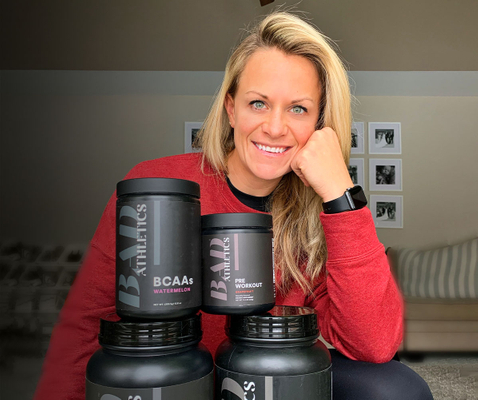woman smiling at camera with Protein powder