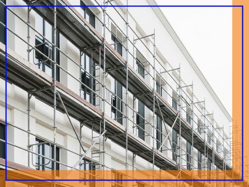 Scaffolding on a modern building facade, indicating ongoing construction or repair work.
