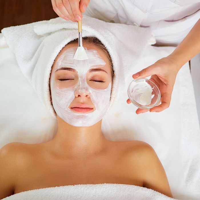 woman getting a facial at a spa