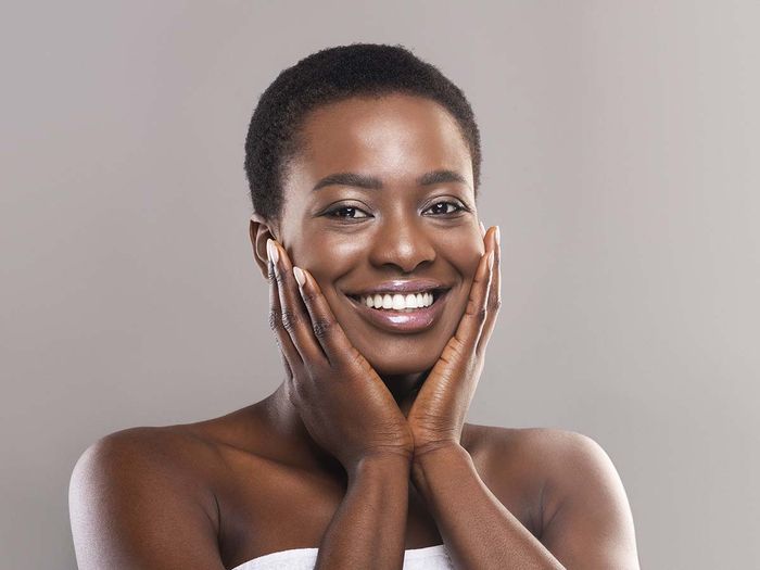 woman happy getting spa treatment