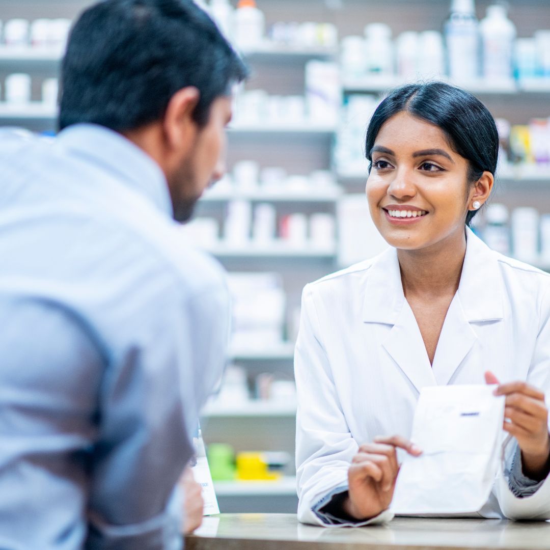 pharmacist speaking with customer
