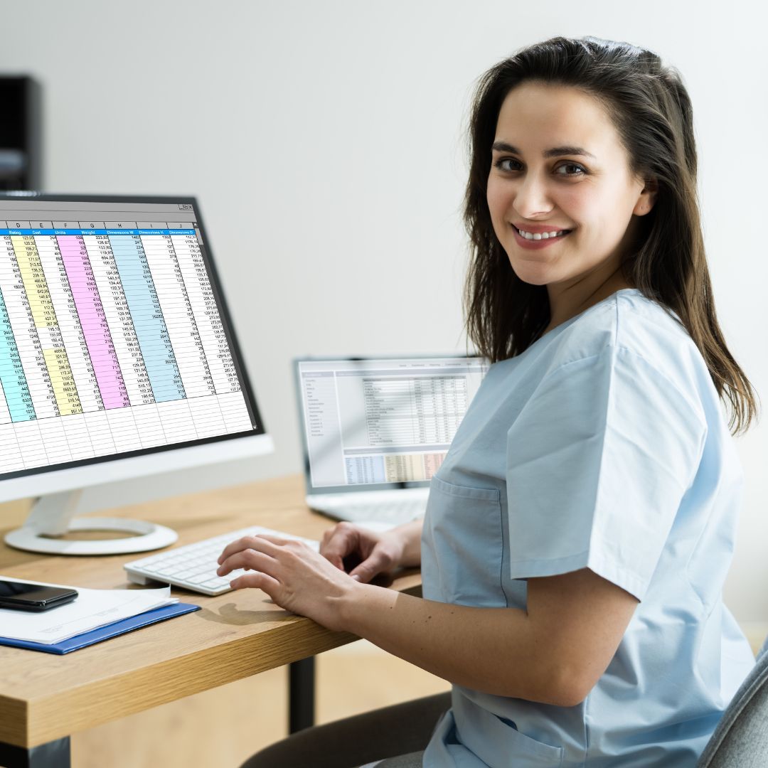a person in scrubs working on spreadsheets