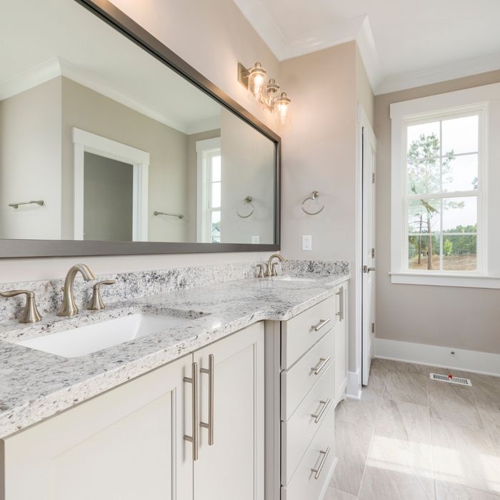 Clean bathroom with marble counters