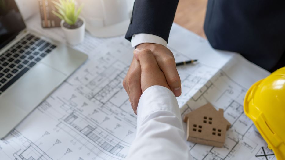 contractor shaking hands with customer