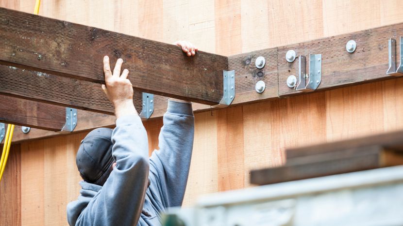 Man building a raised deck