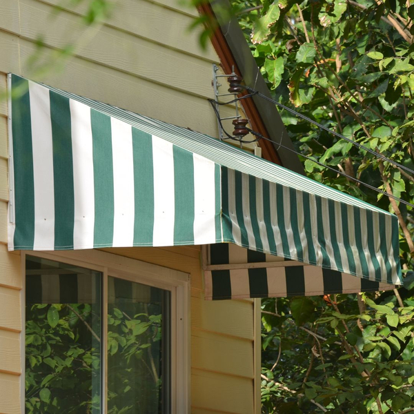 green and white awning above a window on a house