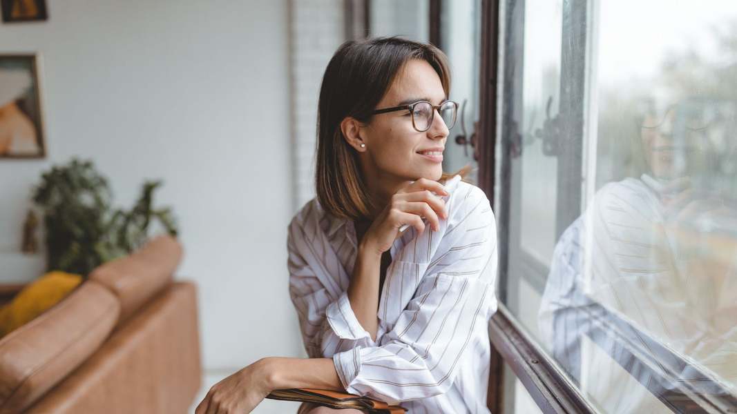 woman sitting by window