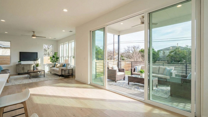 Modern Austin home patio with large sliding glass door.